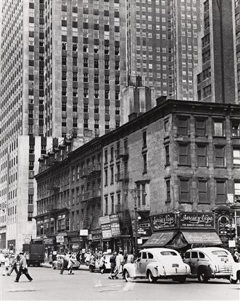 TODD WEBB (1905-2000) Corner of 6th Avenue & 47th Street, with Rockefeller Center building in the background. June 1948.                         